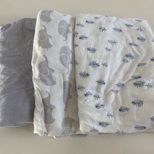 White and Gray Crib Sheets with Elephant and Leaf Patterns